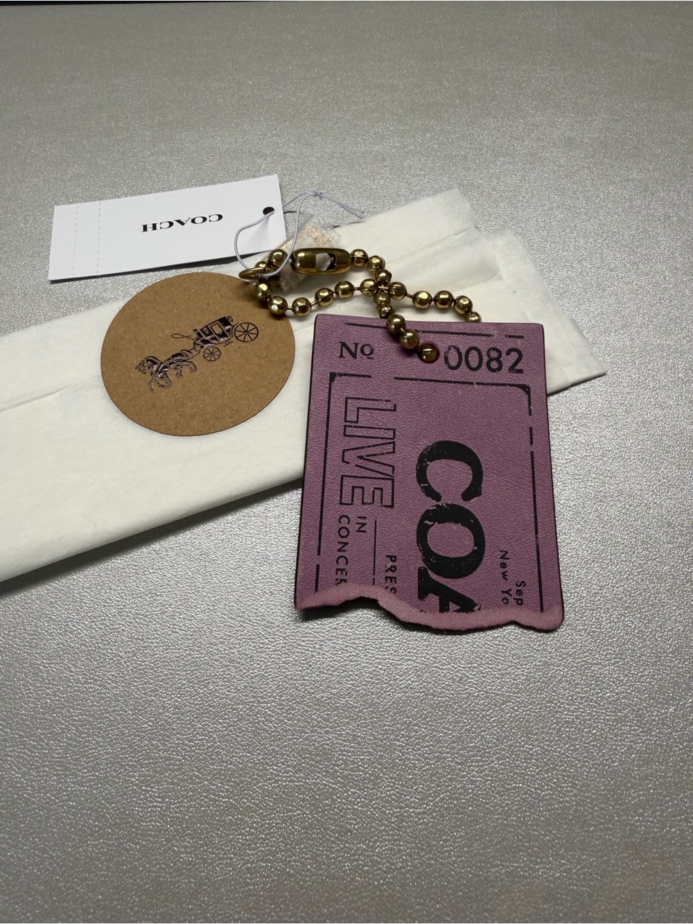 Coach Live In Concert Bag Charm Brass/Lilac